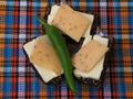 Still life.Sandwiches.Rye bread with butter, cheese and chili pepper.